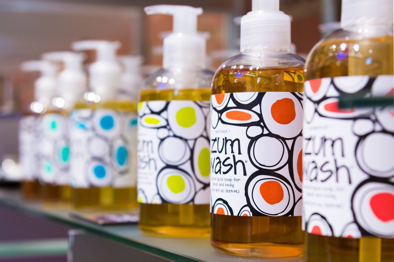 A close-up image of liquid soap bottles on a shelf.