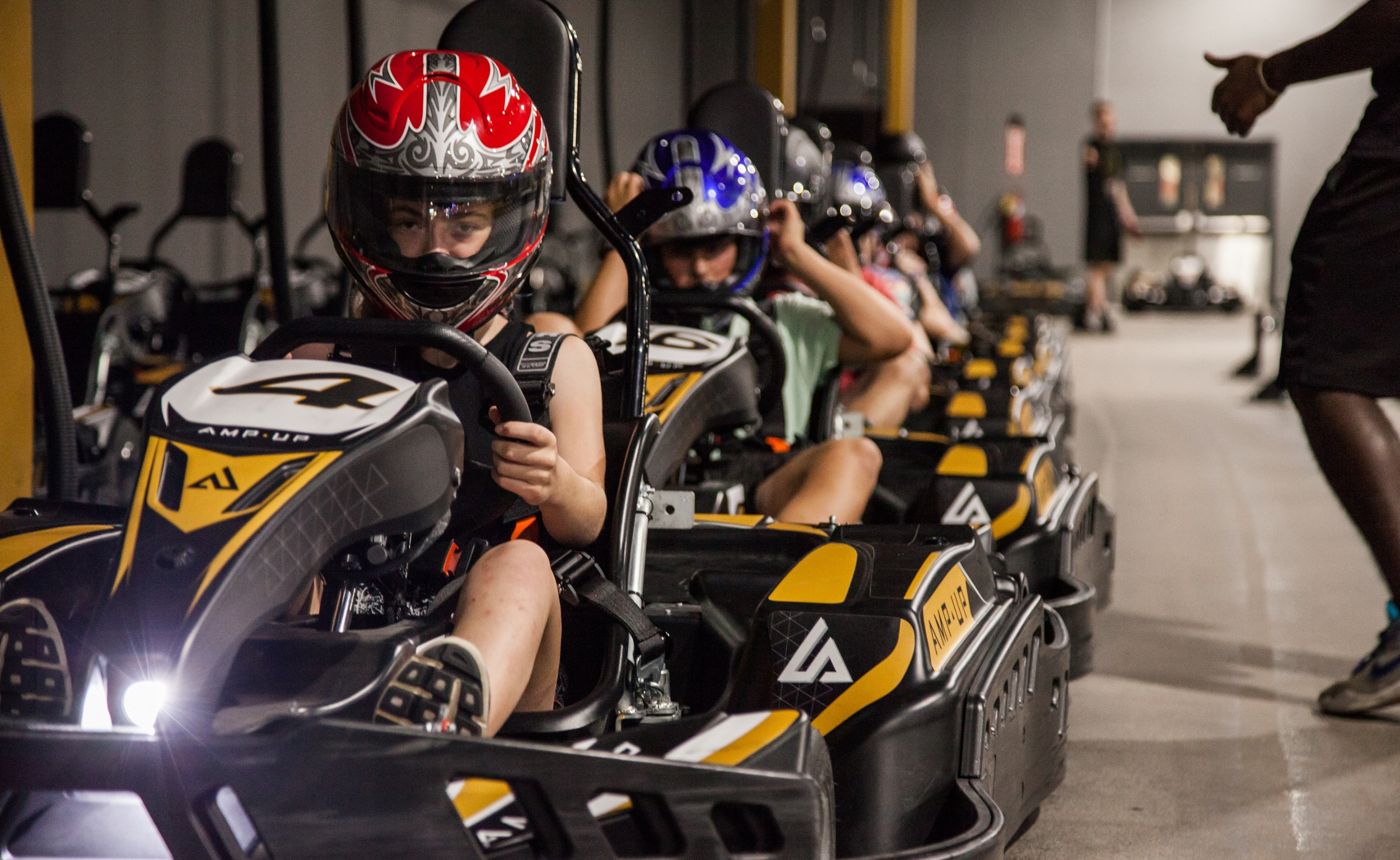 Race zero emissions pro karts at Amp Up Action Park in St. Louis