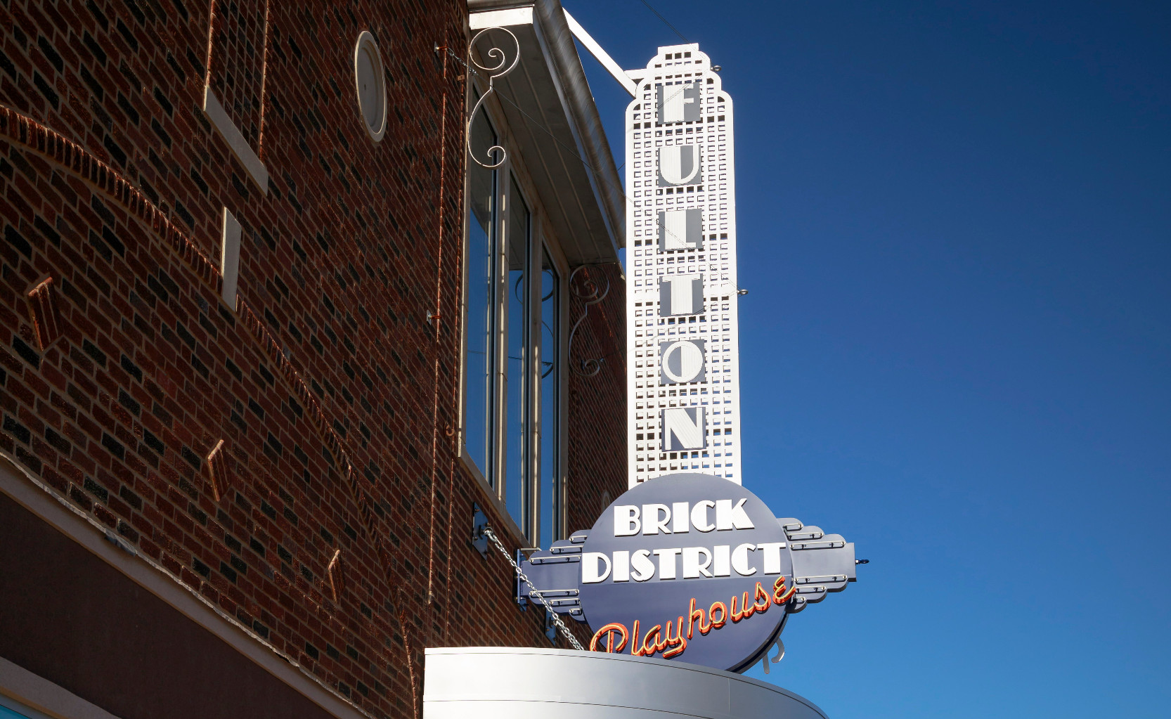 Brick District Playhouse Sign