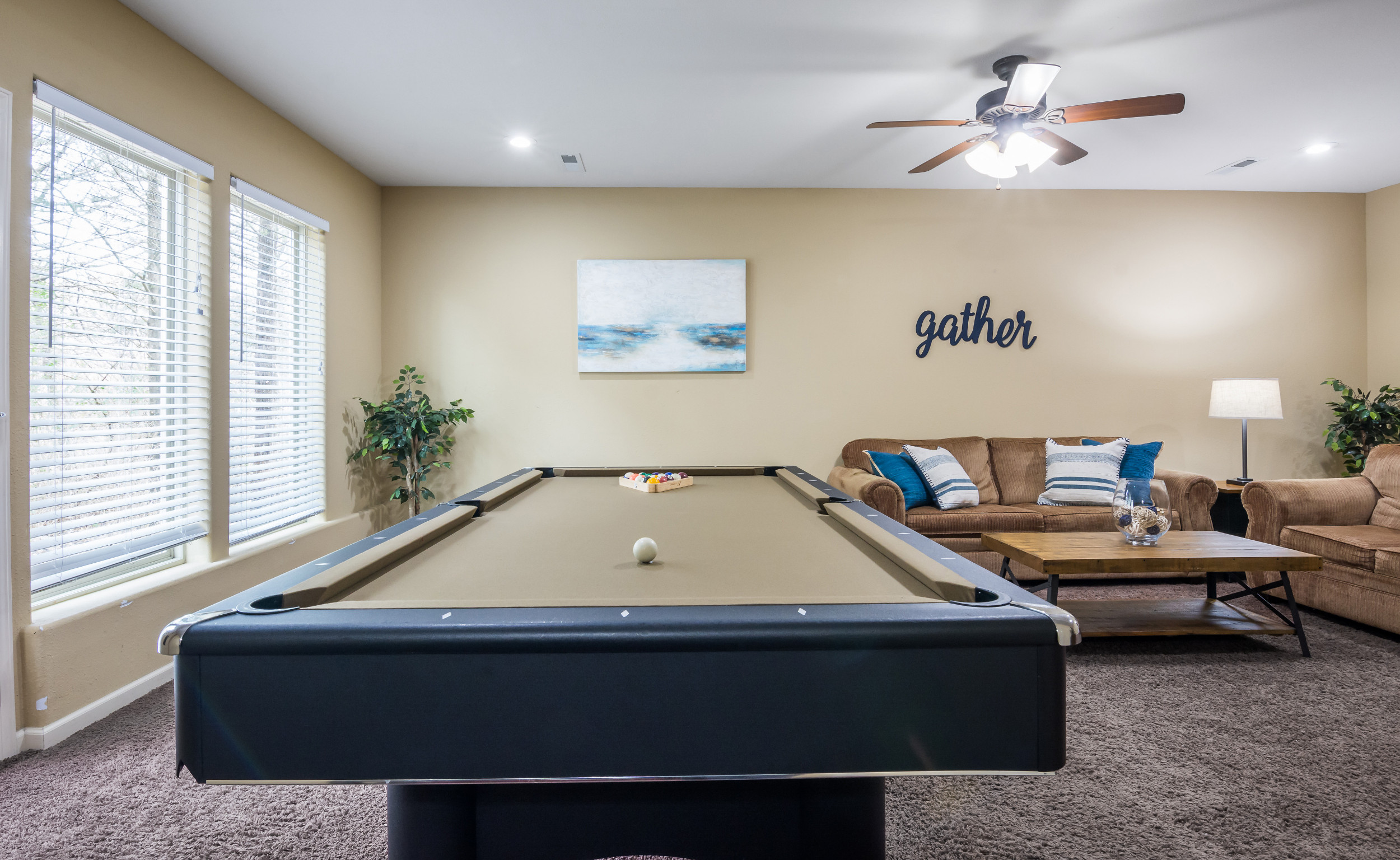 Family room with pool table and foosball at Nature's Retreat
