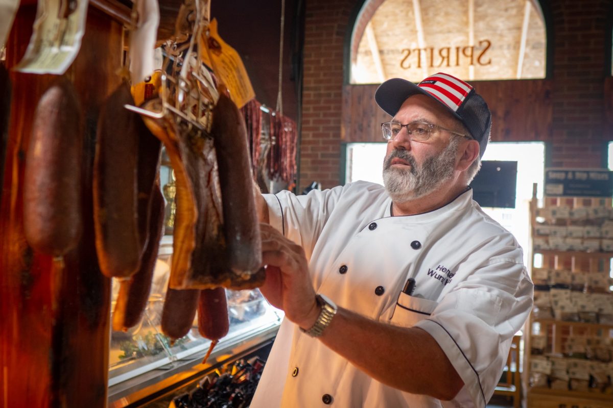 Wurstmeister Mike checking sausage
