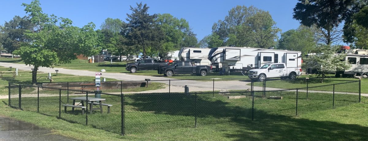 RVs and other veh8icles parked near a campground.