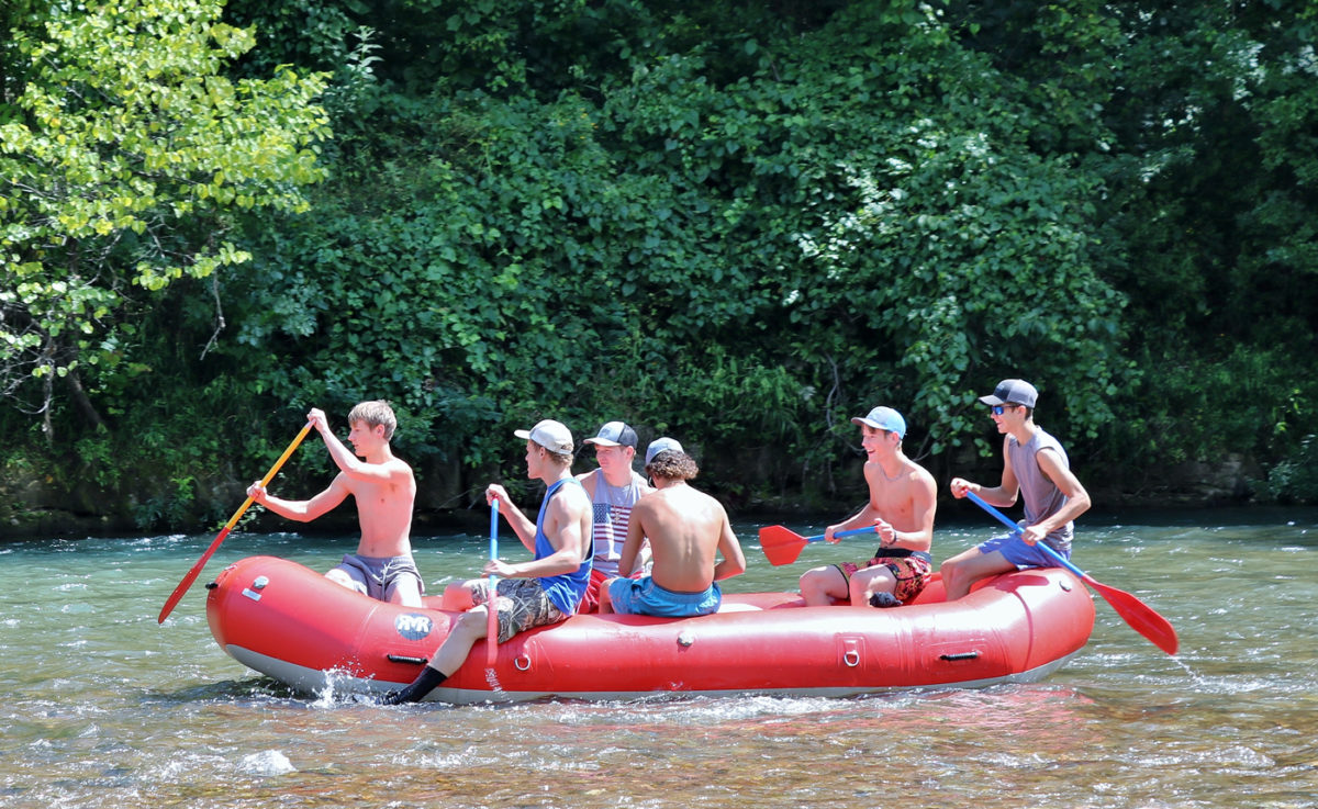 People rafting along a river.