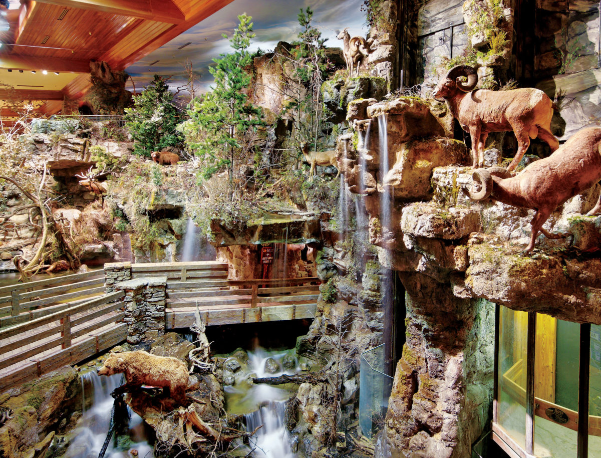 Waterfall and rock formations inside Bass Pro Shops Outdoor World.