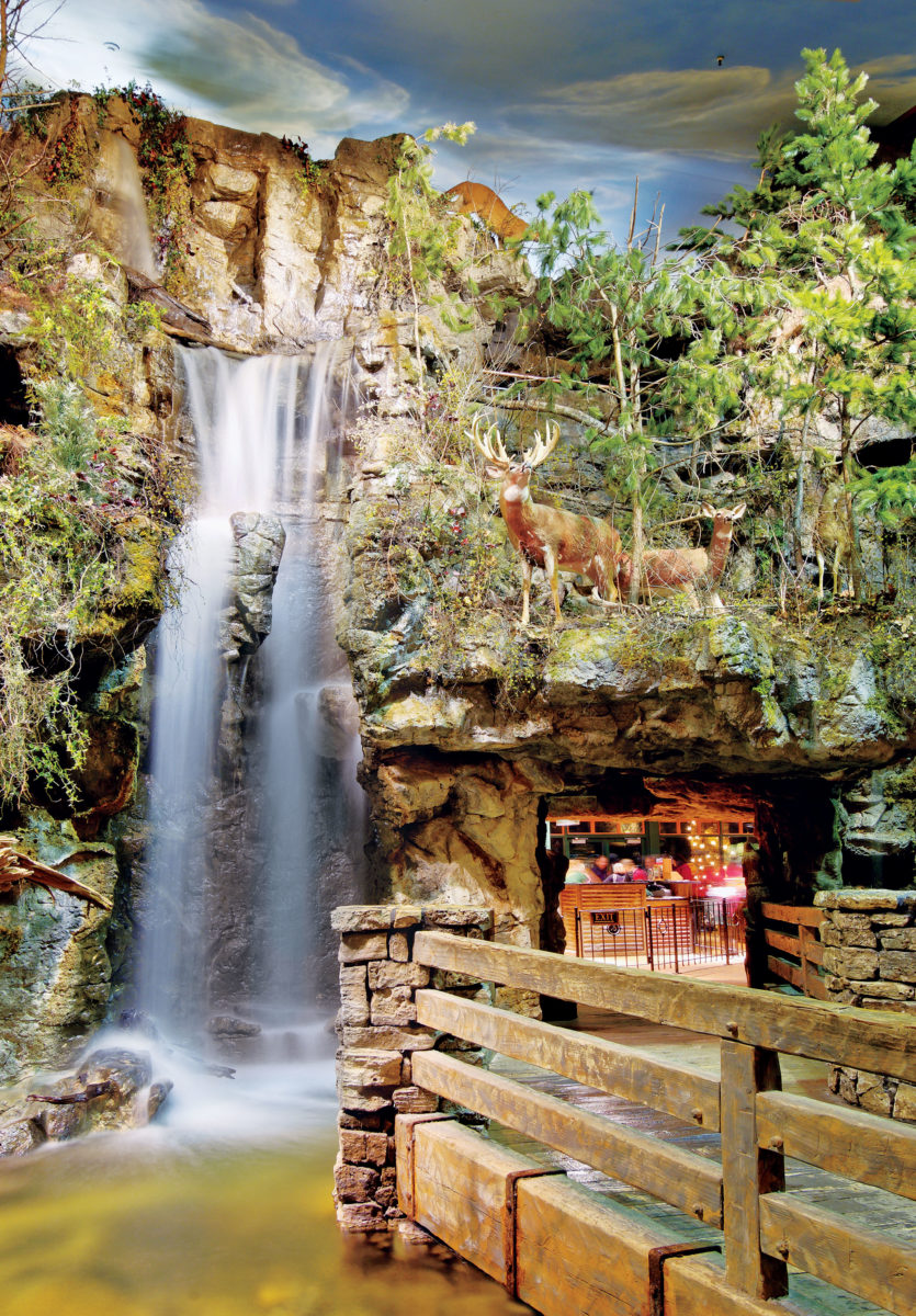 Waterfall and rock formations inside Bass Pro Shops Outdoor World.