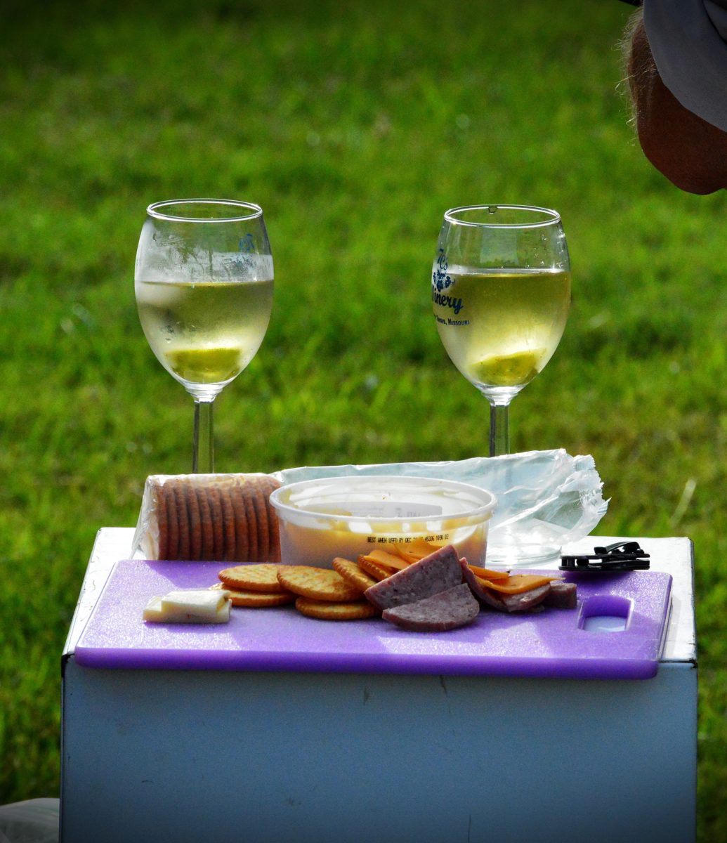 A picnic of wine, cheese and meats.