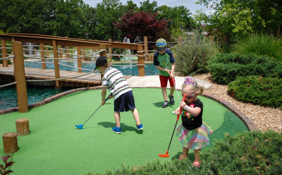 Children enjoying mini golf
