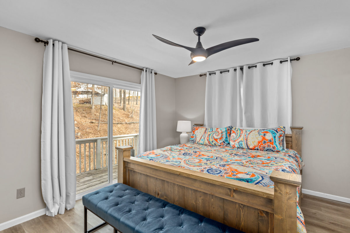 A bedroom with wood and blue accents.