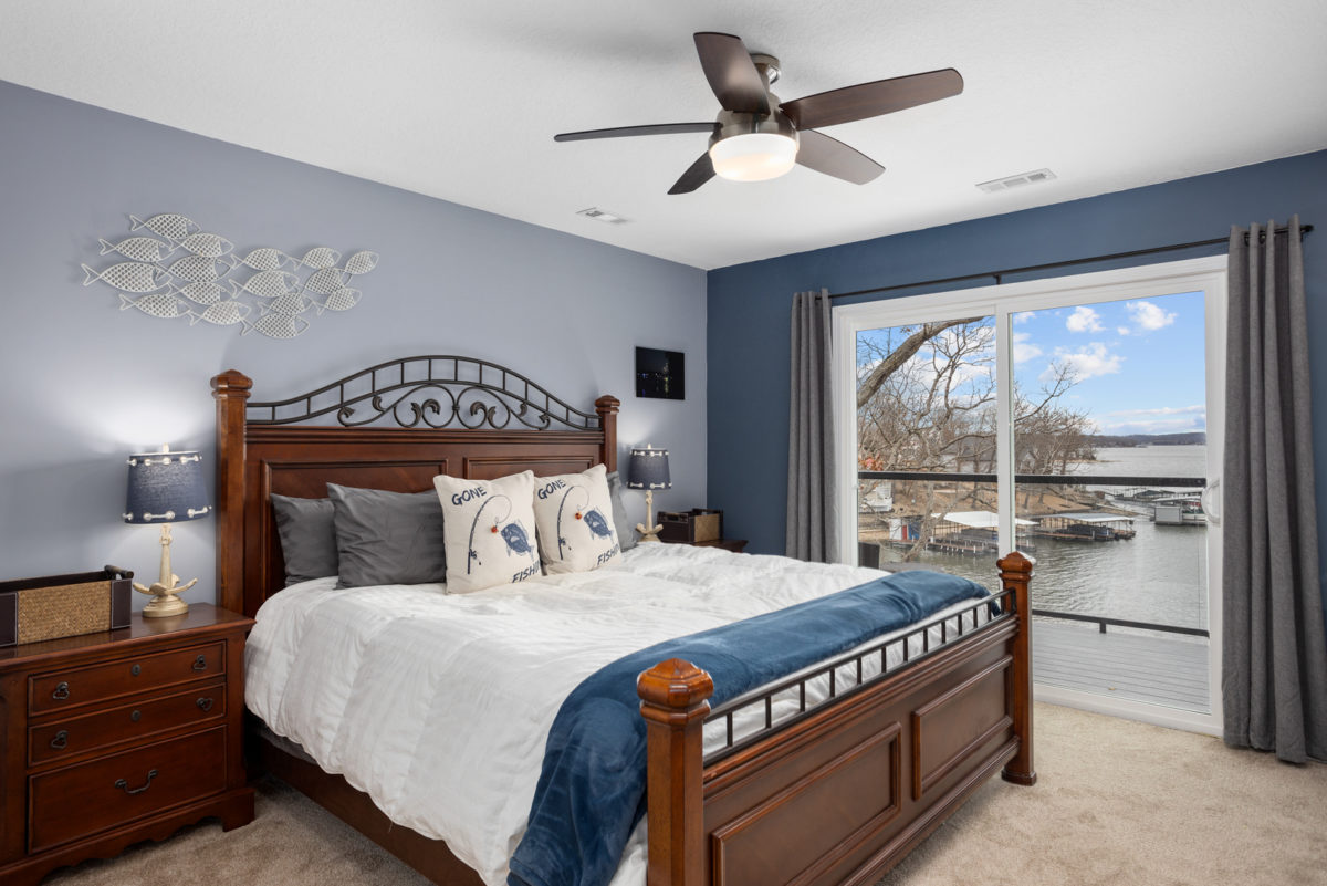 A bedroom in a large vacation home.