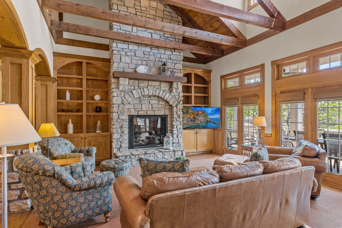 A living room with wood and stone accents.