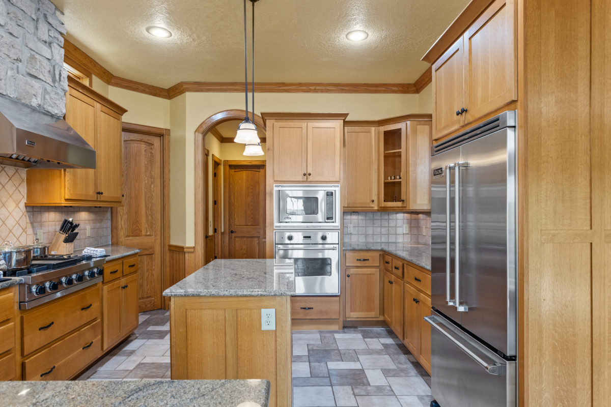 A kitchen with wood and blue accents.