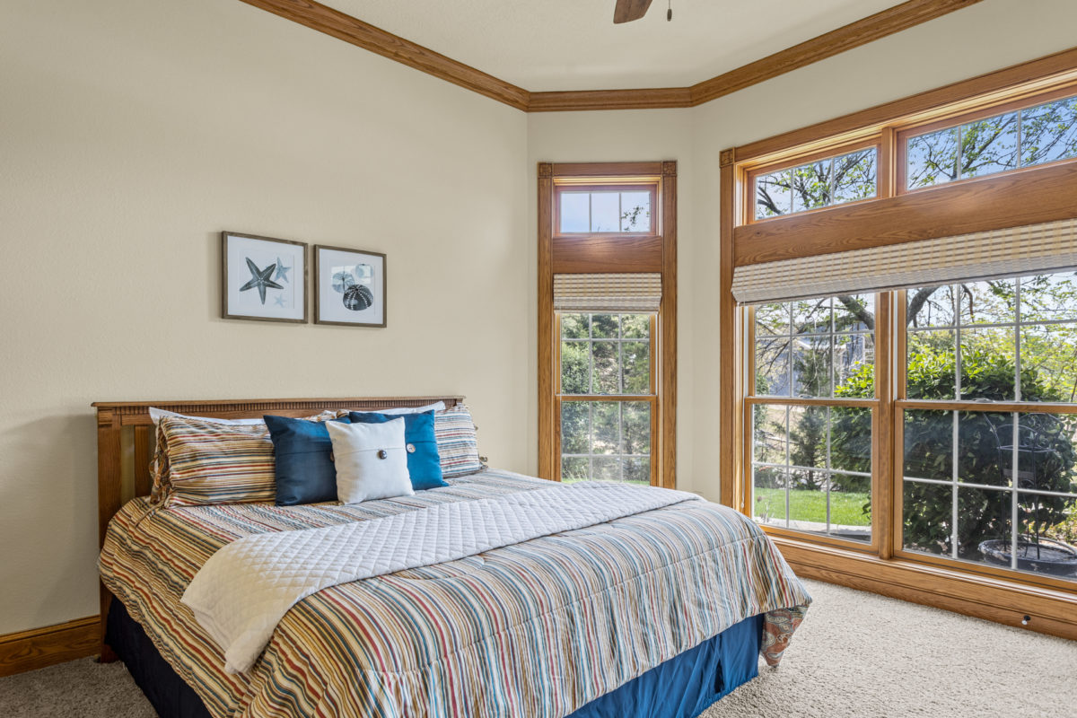 A bedroom with wood and blue accents.