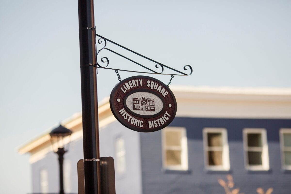 An outdoor sign for the Liberty Square Historic District.