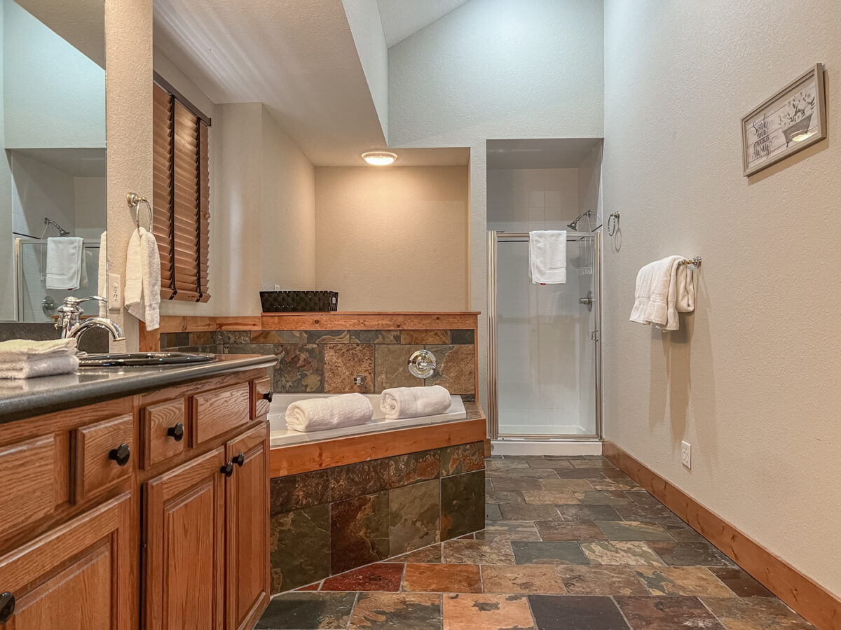 A bathroom of a large vacation home.