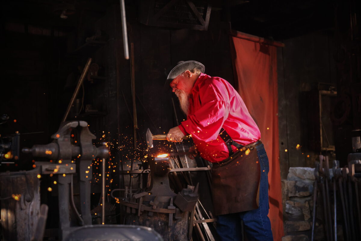Black Smith hammering metal at Silver Dollar City