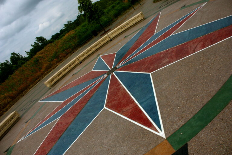 Large compass rosette surrounded by benches