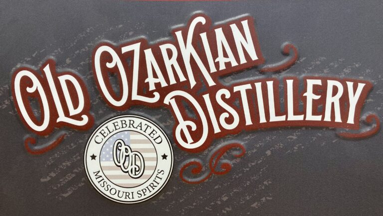The sign for Old Ozarkian Distillery.