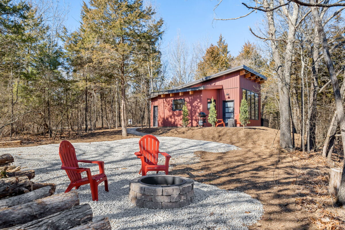 Chairs outside a cabin.