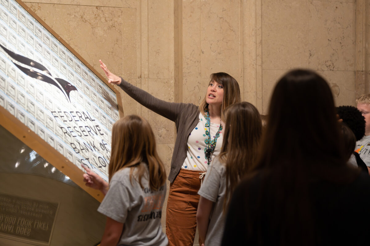 Visitors interact with exhibits and displays in a museum.