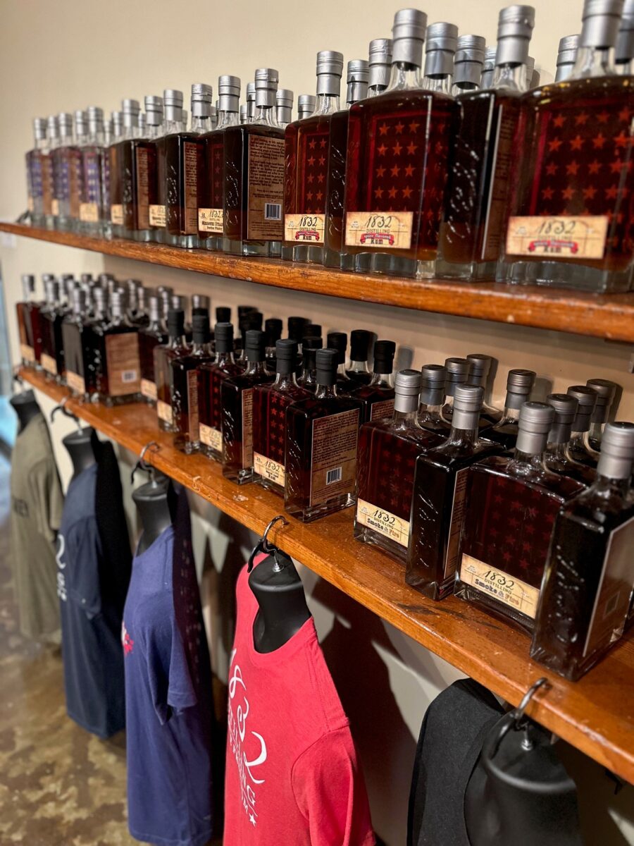Bottles and merchandise lined up on shelves.