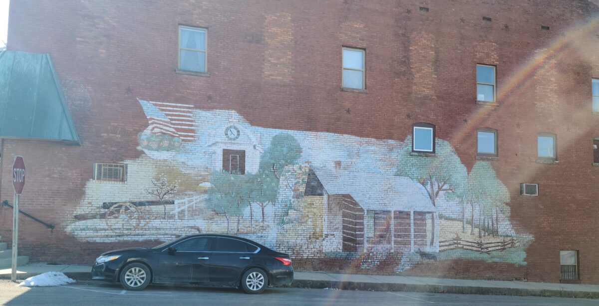 Brick building with mural of house