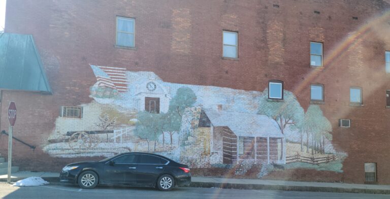 Brick building with mural of house