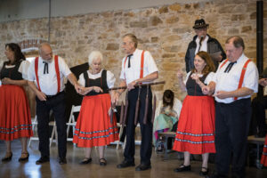 Dancers lined up in traditional German dress at Wurstfest in Hermann.