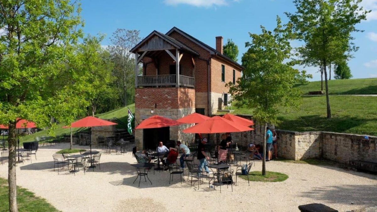 The exterior of a building with covered seating outside.