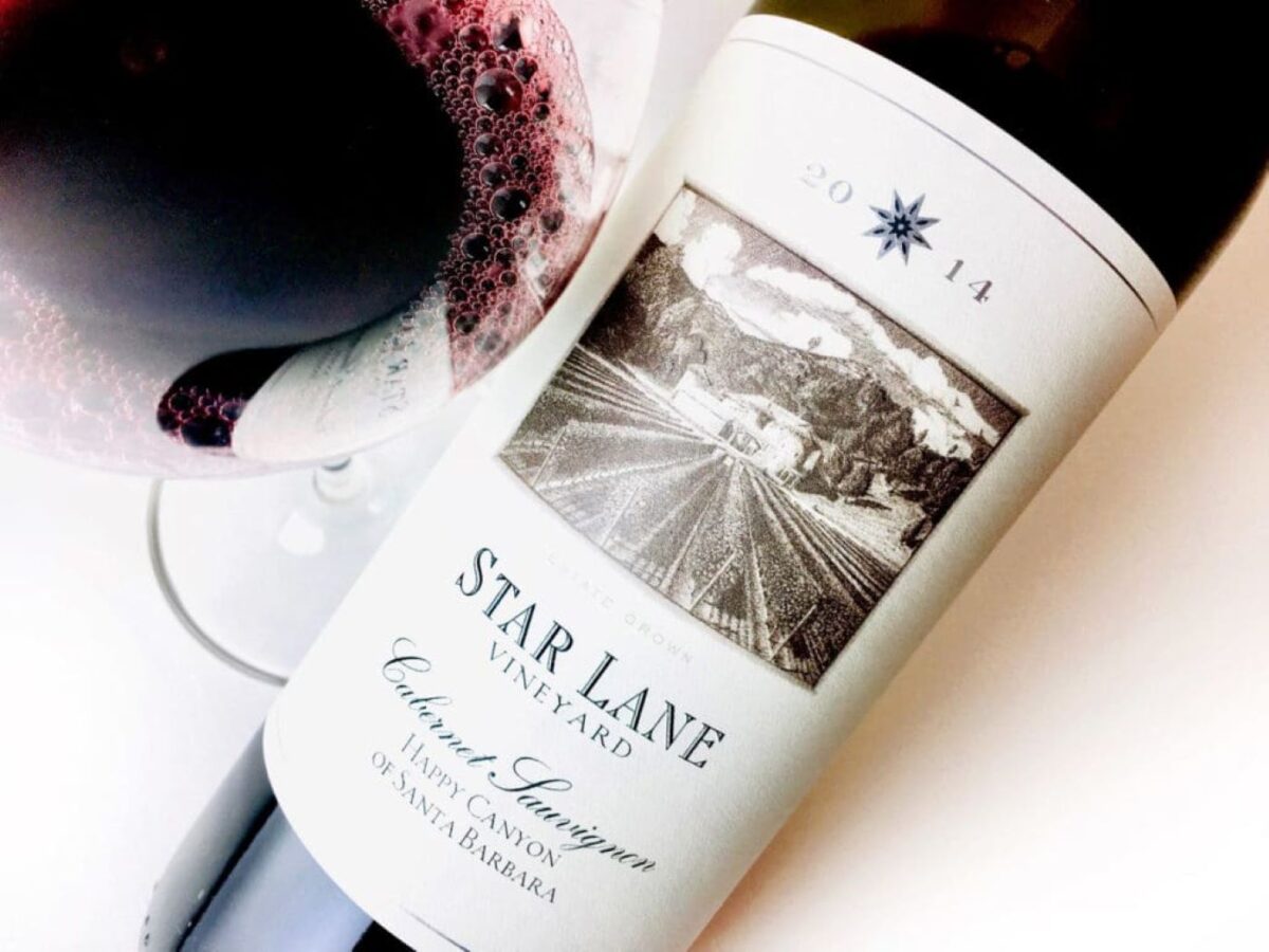 A wine bottle and label for Star Lane Vineyard wine.