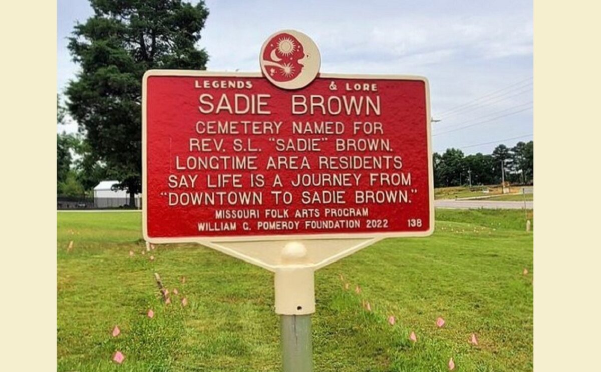 A red plaque memorializing Sadie Brown.