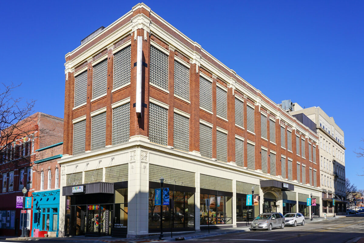 The exterior of a brick and concrete building.