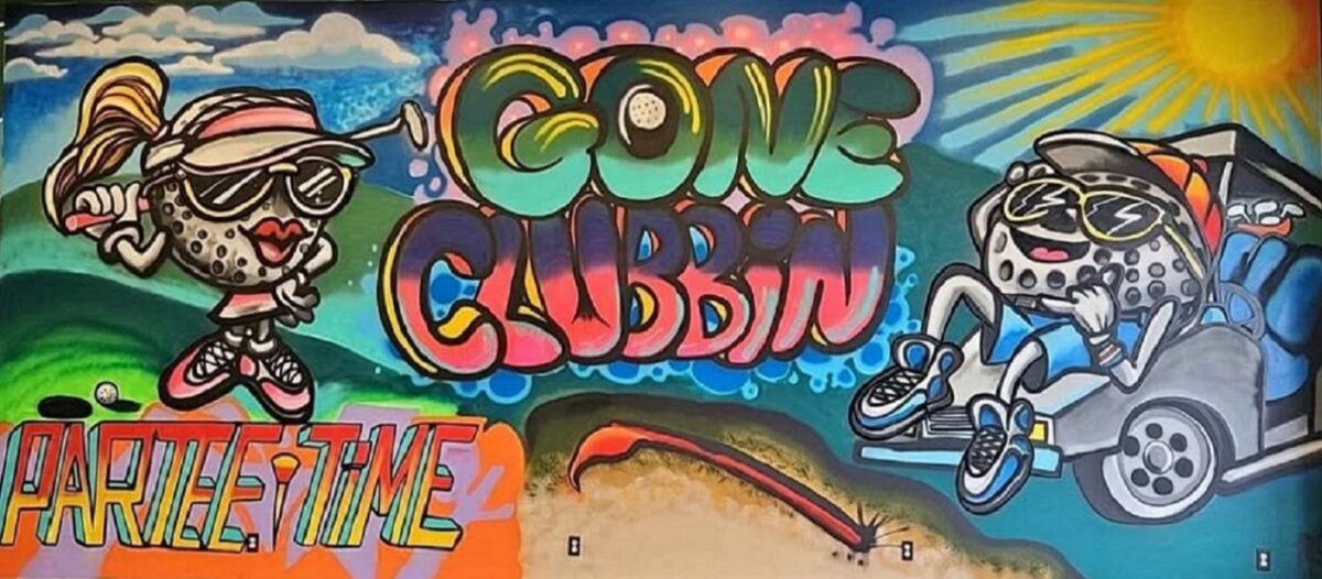 A colorful mural advertising a virtual golf business.