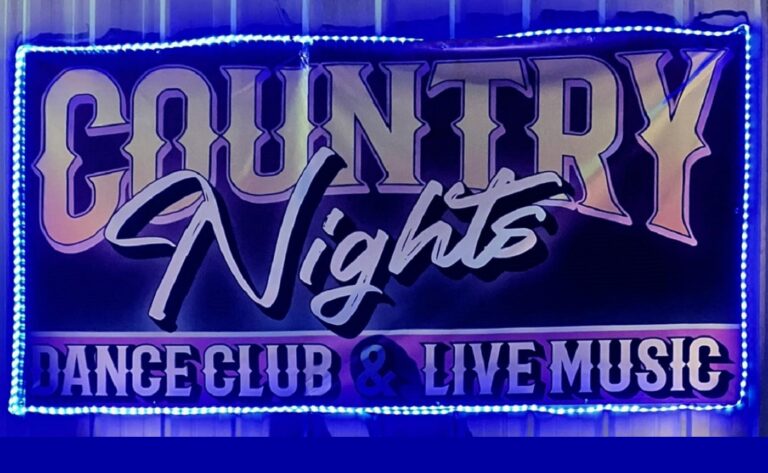 Lighted banner advertising Country Nights, a dance club with live music.