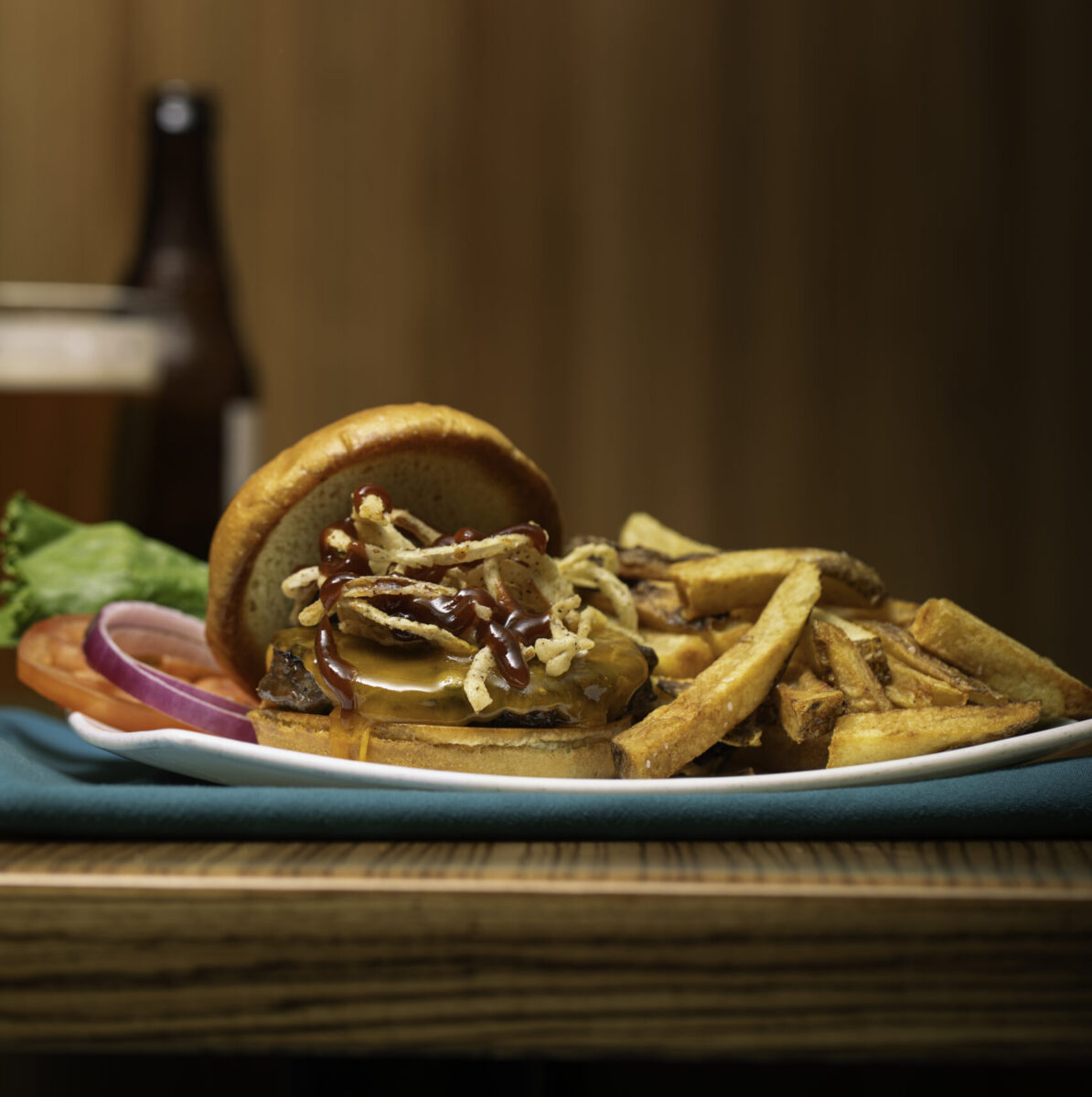 A sandwich and fries on a plate.