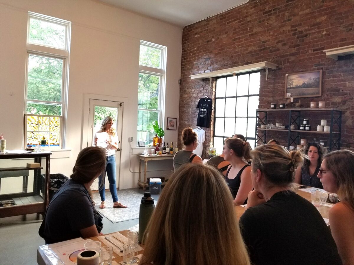 People at tables during a presentation.