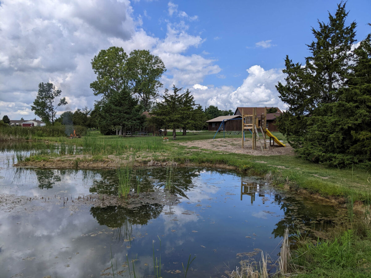 A fishing lake near a cabin park.