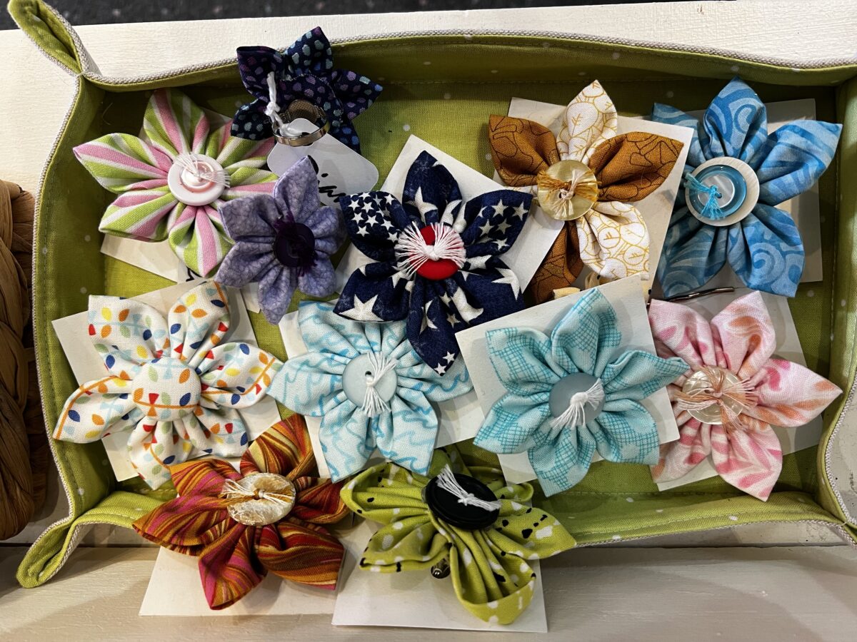 Colorful pinwheels arranged in a box.