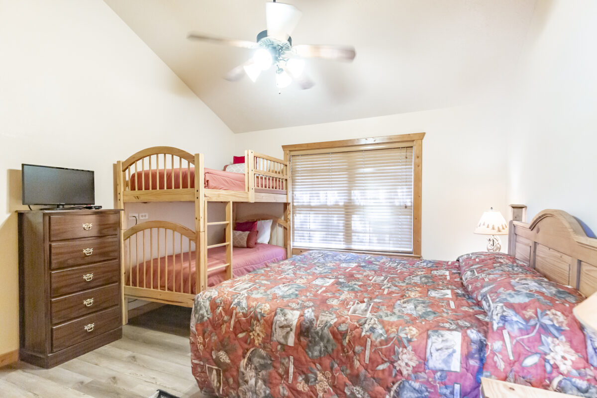 The bedroom of a resort cabin.