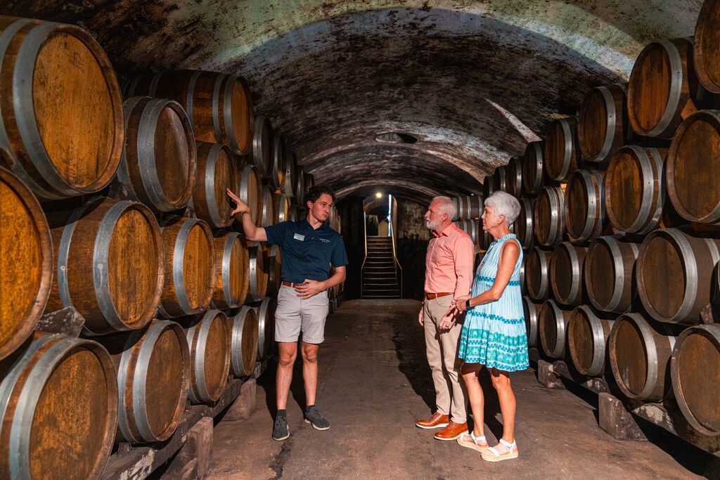 A tour guide leads a tour of the historic arched winer cellar at Stone Hill Winery in Hermann.