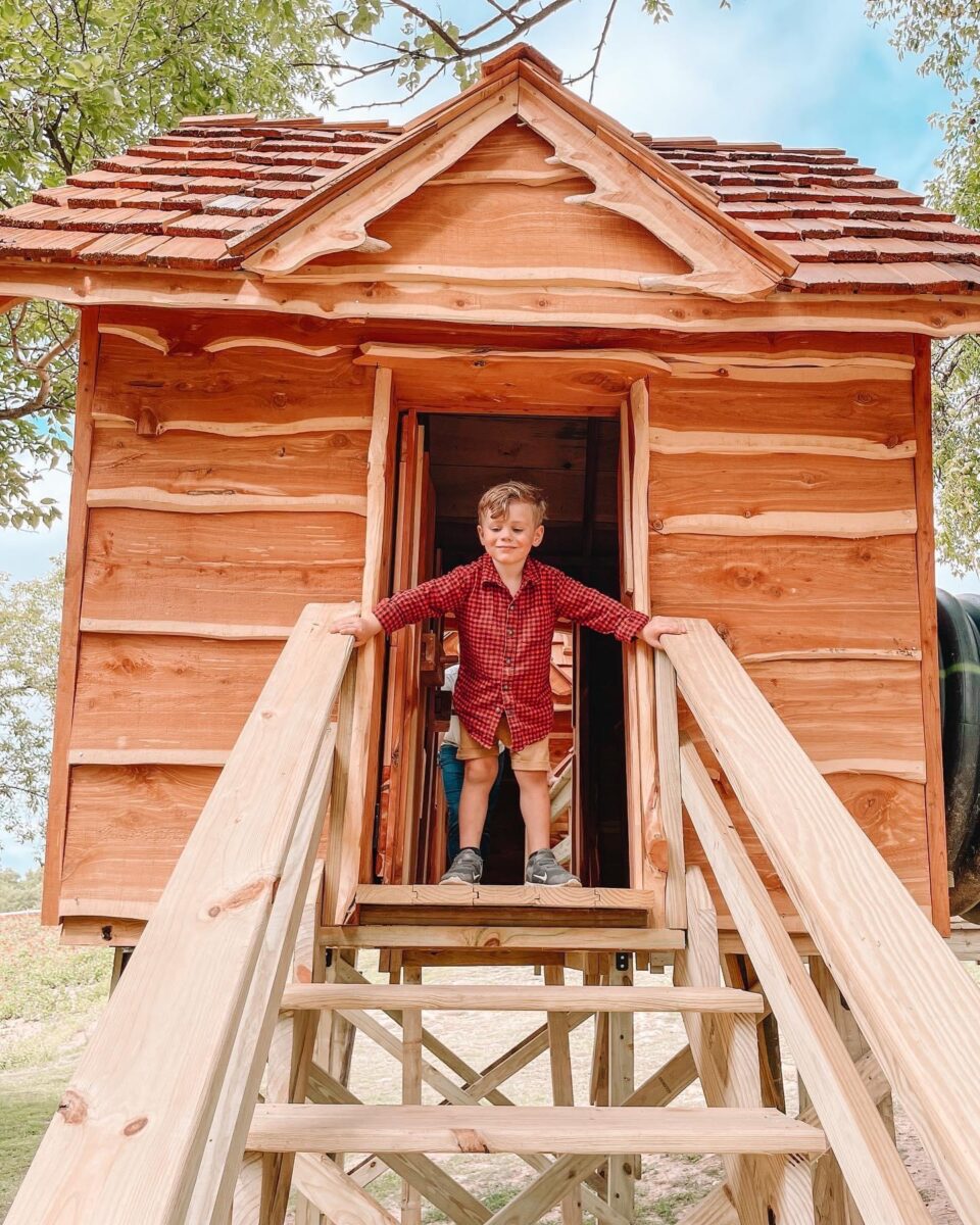 A child plays on equipment at Historic Weston Orchard and Vineyard.
