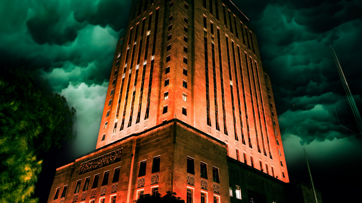 City Hall in Kansas City stands lit at night against a dark sky.