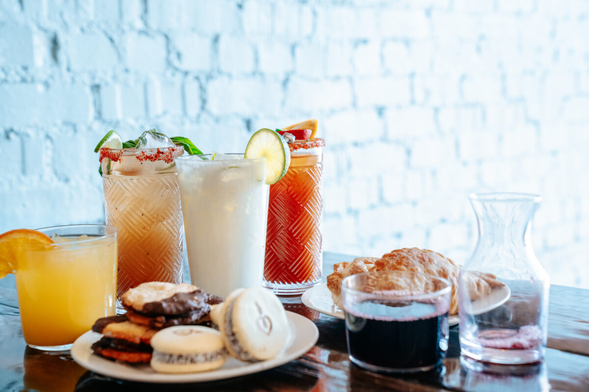 A spread of food and drinks on a table.