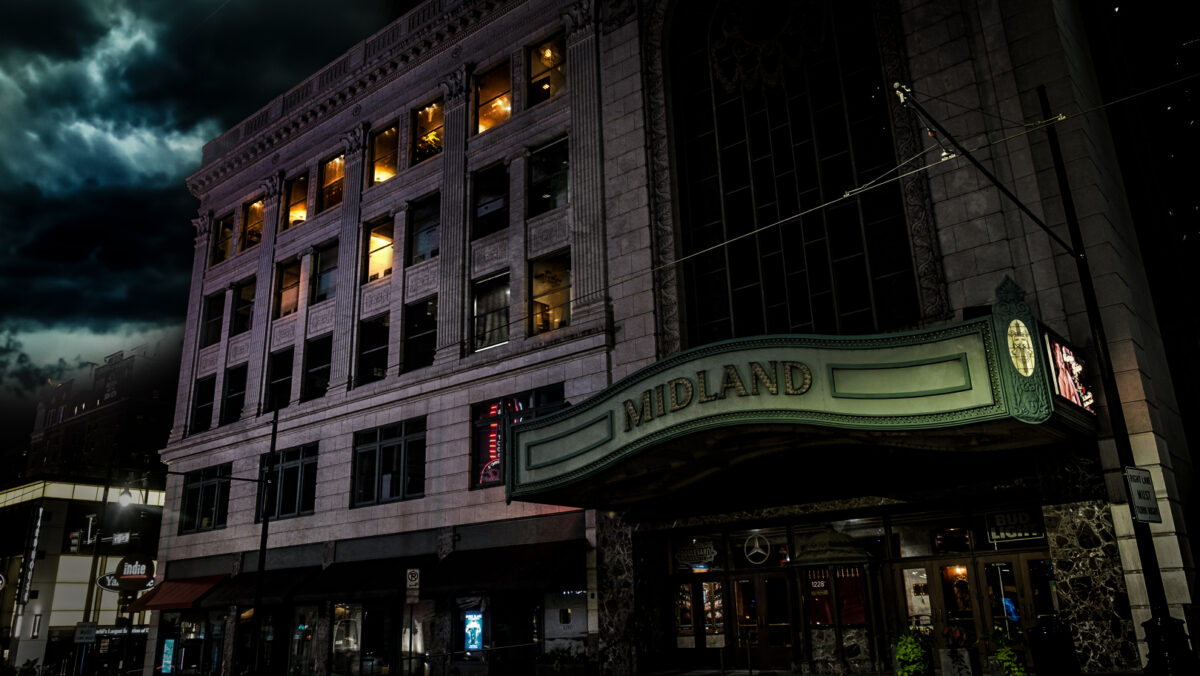 The Midland Theater stands dark and ominous at night.