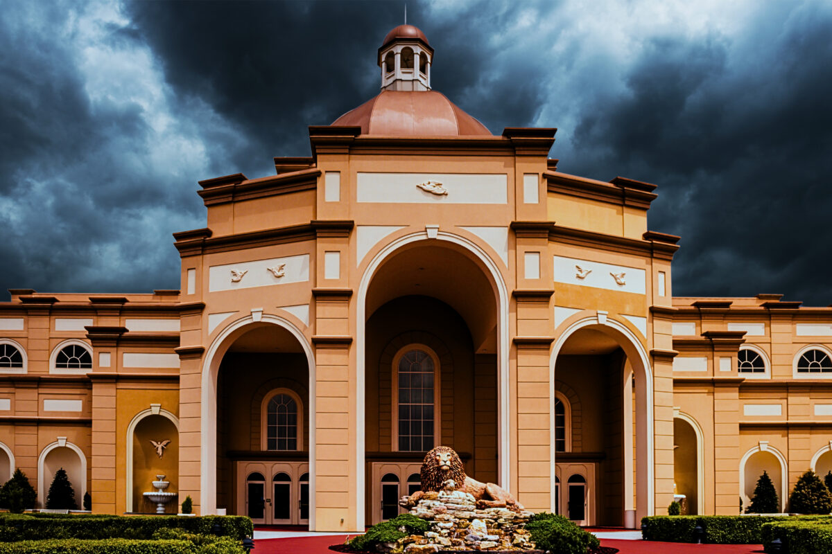 The exterior of Sight and Sound Theatre Branson backed by ominous dark clouds.