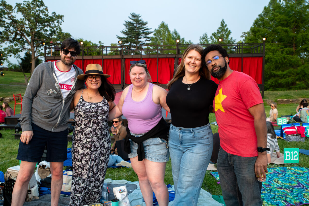 Attendees enjoy an outdoor Shakespeare event.