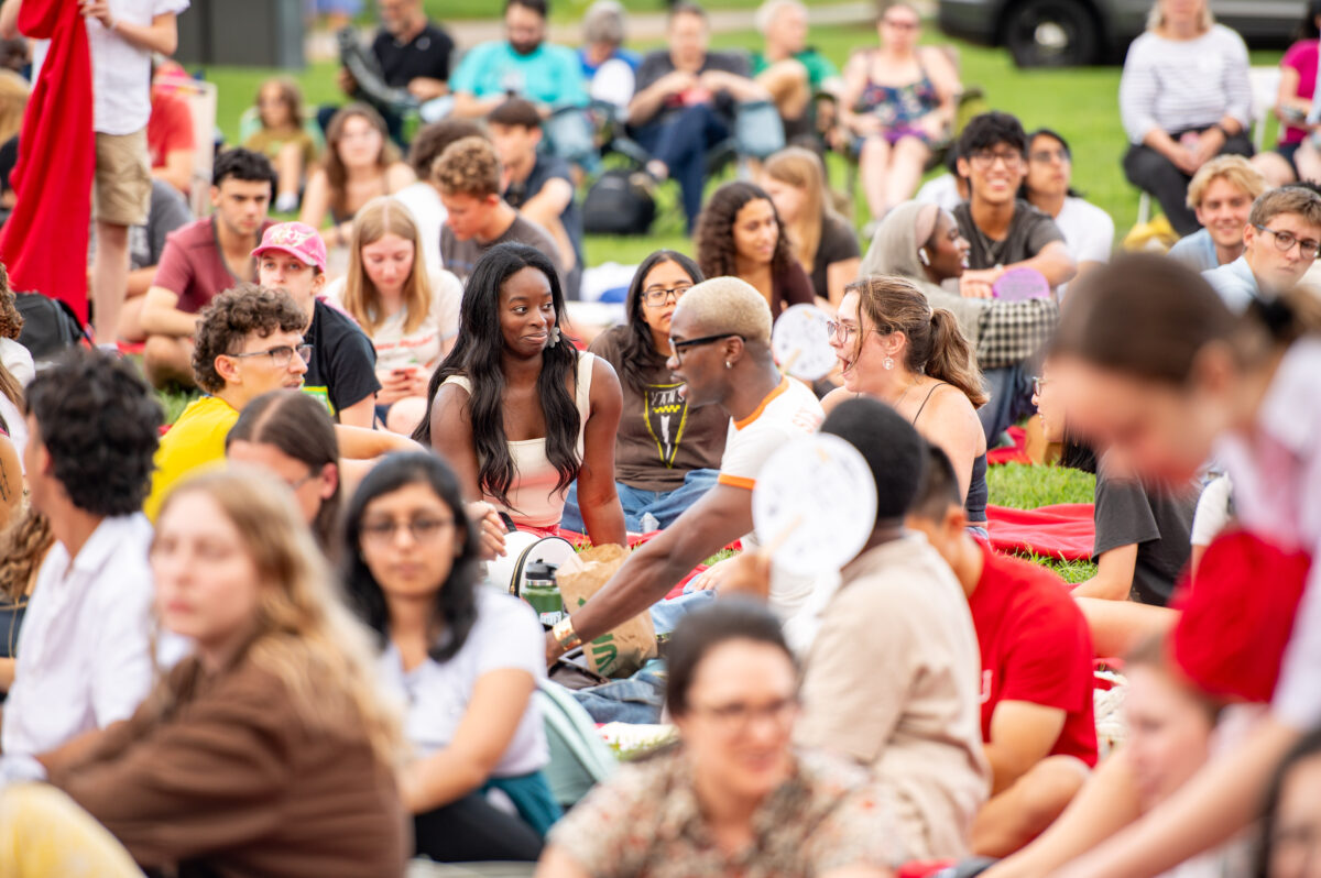 Attendees enjoy an outdoor Shakespeare event.