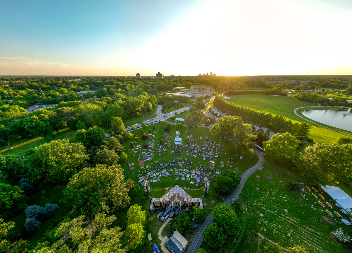Attendees enjoy an outdoor Shakespeare event.