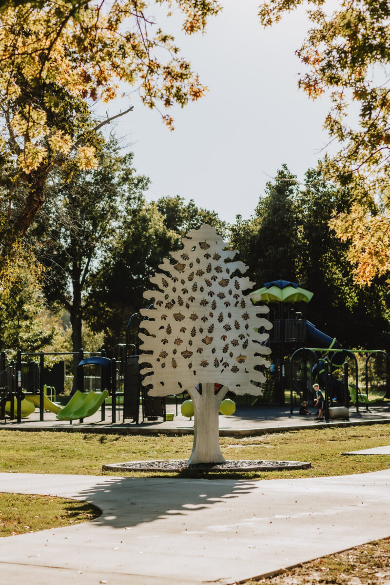 A piece of equipment resembling a tree in a park.