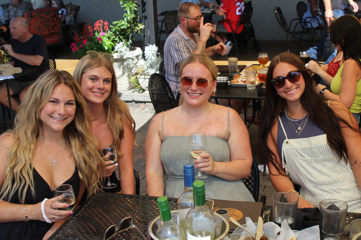 A group of women pose for a photo at the winery.