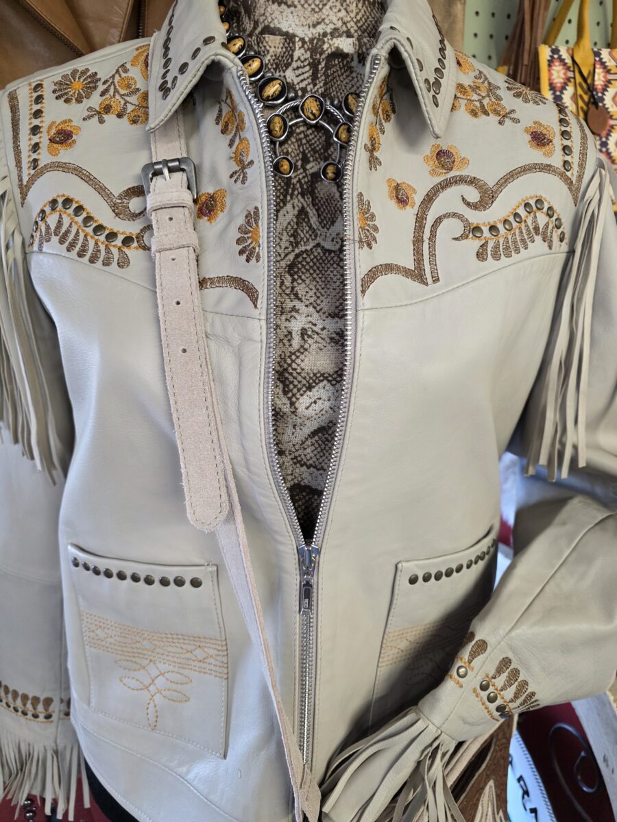A western-style jacket displayed on a mannequin.